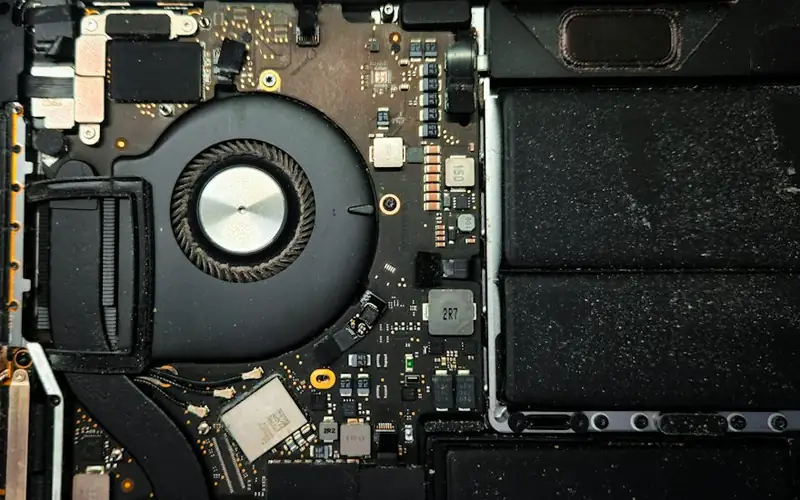 Cooling fan and circuit board inside an opened laptop